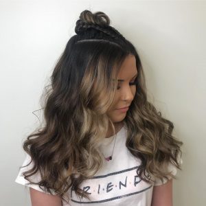 Braids into top bun with long hair down for prom from Hair Cuttery