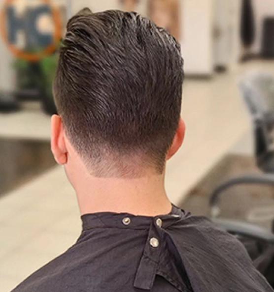 Man with fade haircut sitting in Hair Cuttery. Image links to Hair Cuttery's Instagram account.