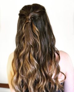 Half updo with loose waves for prom from Hair Cuttery